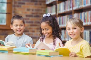 Children in school with a book