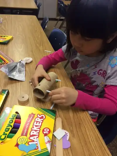Students working on balloon powered car