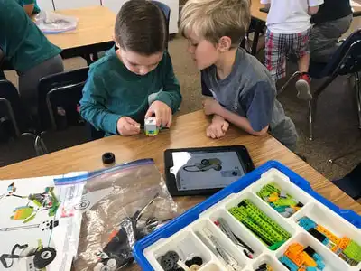 students building with legos