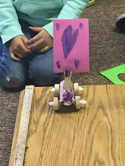 Students working on balloon powered car