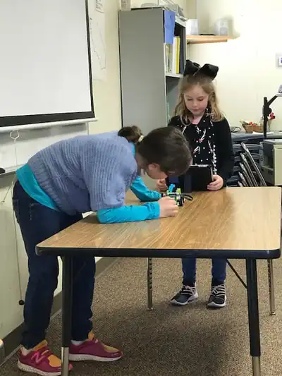 students building with legos