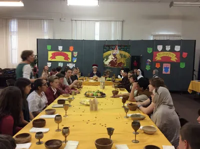 Students in class with wooden bowls and cups